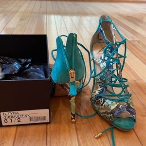 Brian Atwood lace up peep toe sandals.Snakeskin 4 inch heel.